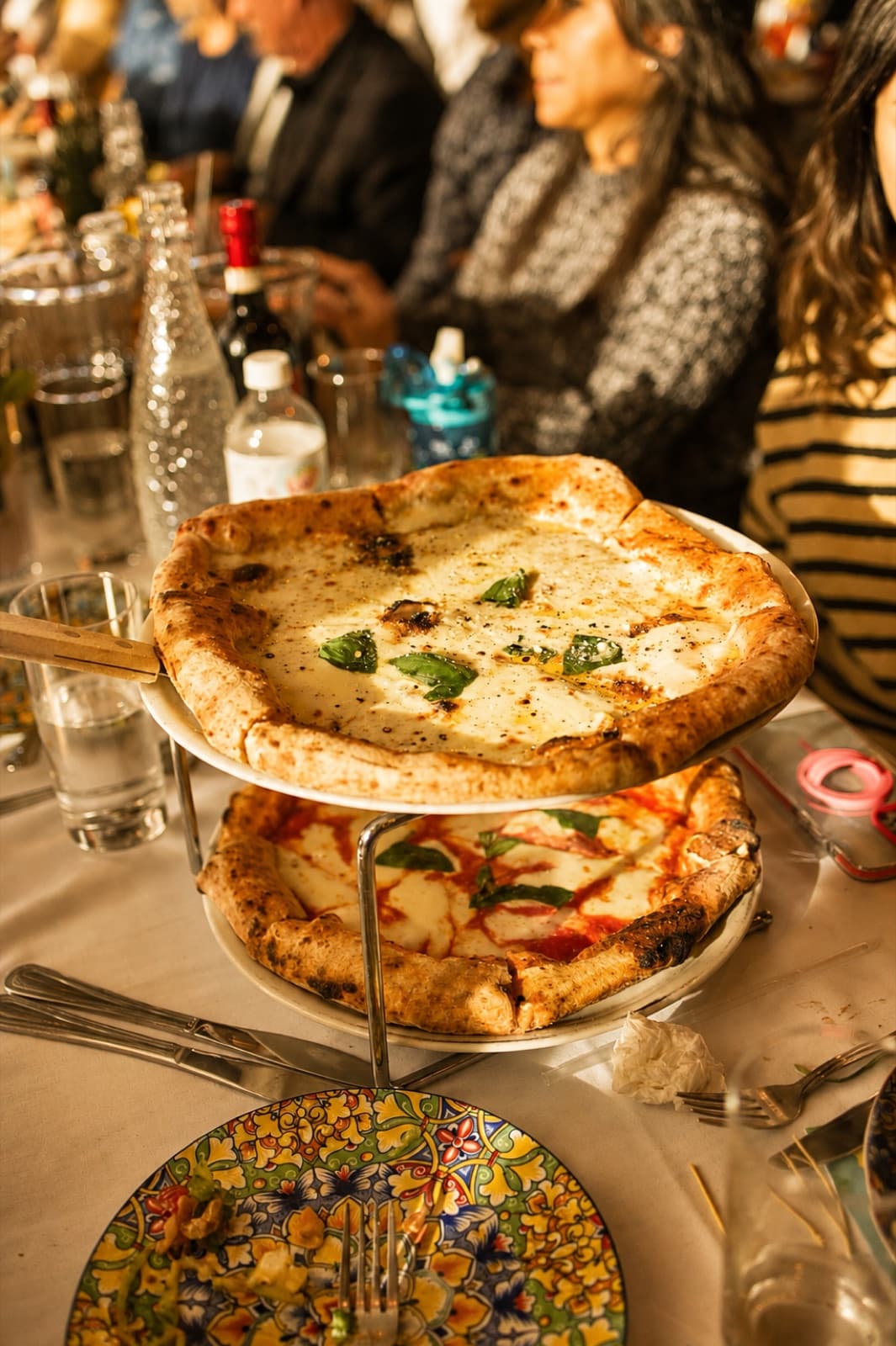Wood-fired Neapolitan pizzas on a tiered stand