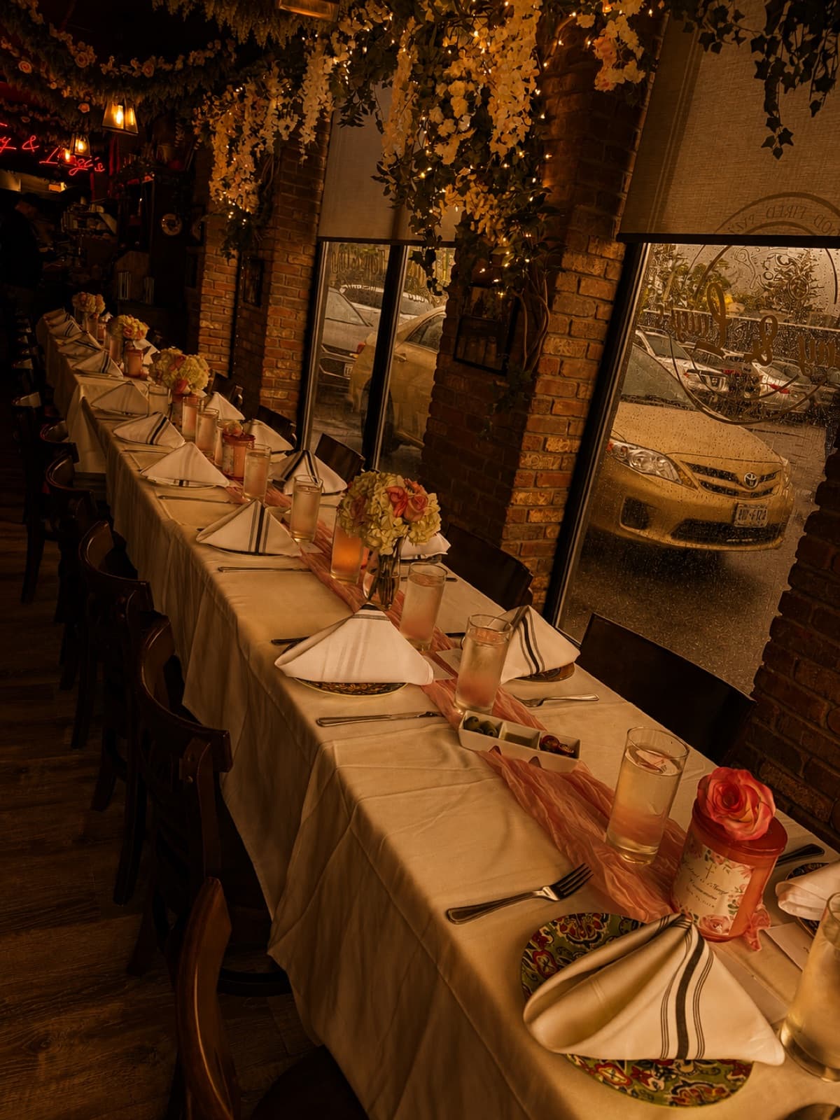 Elegant long banquet table with floral centerpieces